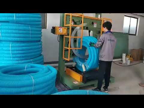 Vertical hose coil wrapping machine