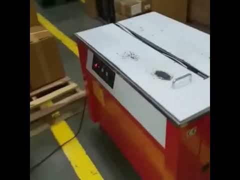 Heavy Duty Semiautomatic Box Strapping Machine.