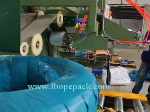 Automatic coil stretch wrapping machine with end sealer