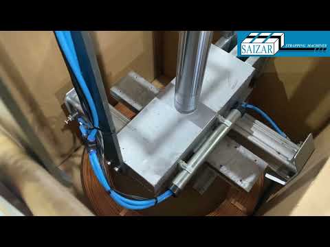 Automatic strapping and packaging line for copper wire coils.