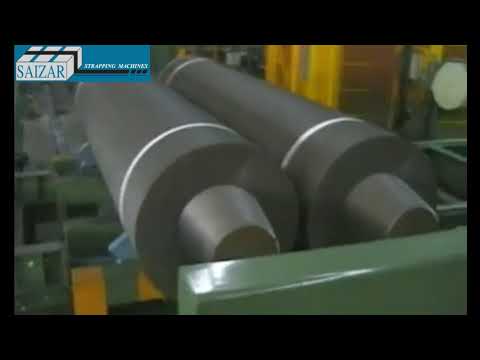 Automatic strapping machine with steel strap for electrodes.