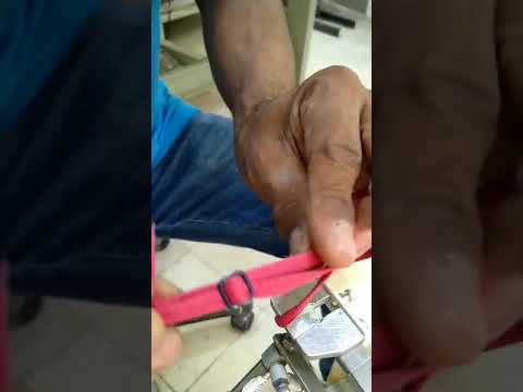 pneumatic strap slider inserting machine