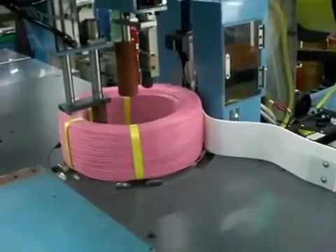 wire coil wrapping and wire strapping machine
