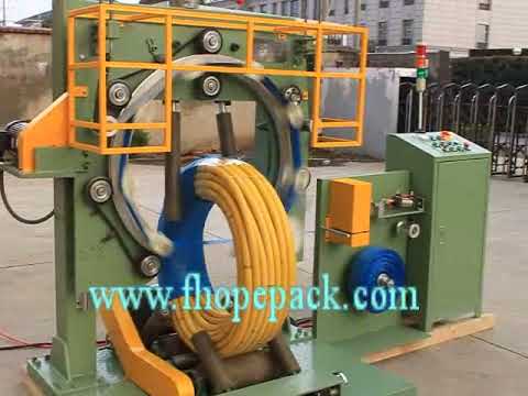 Hose coil packing machine