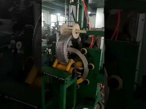 Coil wrapping machine and pipe coil packing machine
