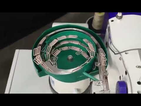 Semi-automatic strap wearing machine