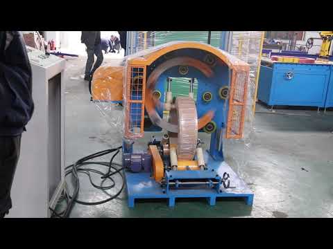 Coil wrapping machine with two layers at the same time