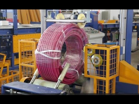 Pipe coil packing machine and hose wrapping machine