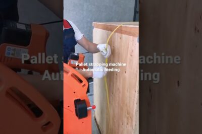 Strapping machine for battery pallets with PET or PP strap.