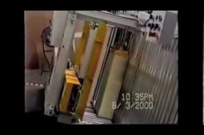 Automatic strapping machine with side seal.