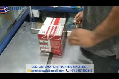 Strapping machine that requires partial manual input.