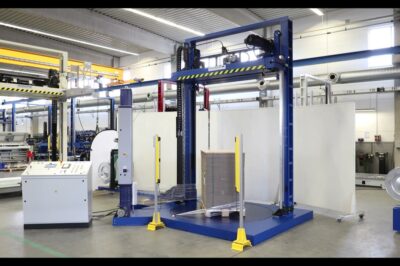 Fully automatic pallet strapping machine with integrated stretch wrapper.
