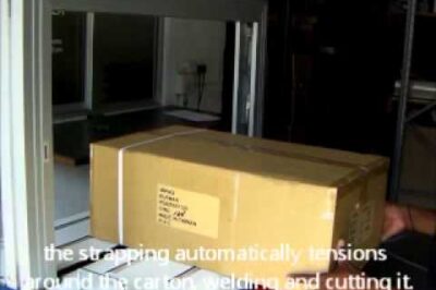 Fully automated strapping machine for packaging.