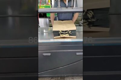 Strapping machine with compression feature.
