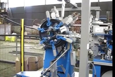 Coiling and strapping machine for HDPE pipes and rubber hoses that operates automatically.