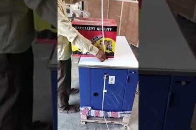 Strapping machine for packaging boxes.