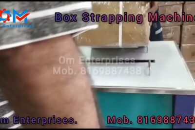 Machine for securing boxes with straps.