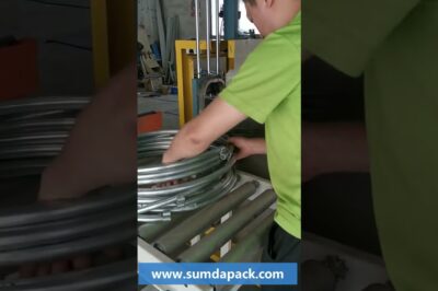 Steel bar coil strapping machine that operates automatically.