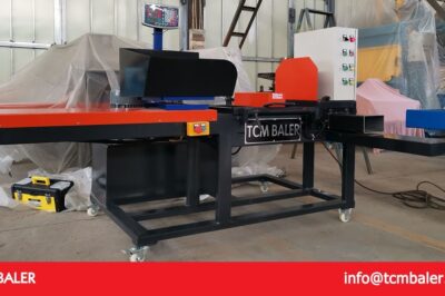 Compact baling machine for rags and bags.