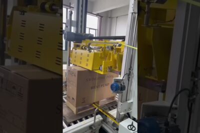 Vertical pallet strapping machine for automated pallet packing and strapping with polypropylene strapping.