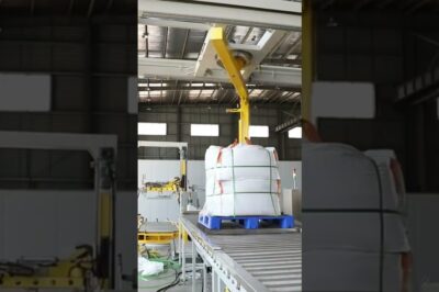 Pallet strapping, rotating wrapping machine, and top sheet dispenser combined in a horizontal setup.