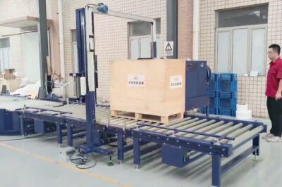 Pallet strapping and wrapping machine with automated functionality.