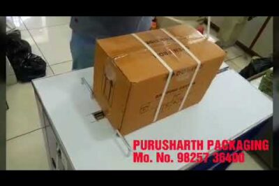 Compact strapping machine for boxes with automatic function.