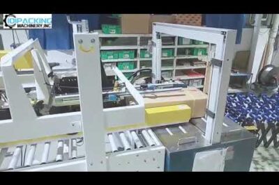 Short semi-automatic box sealing and strapping machine for top flip closing with PP strapping.