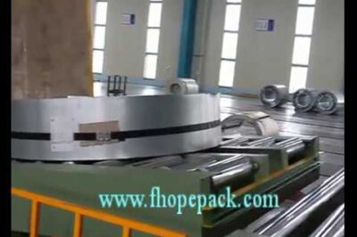 Compact coil upender and packing machine for efficient coil handling.