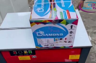 Strapping machine that operates partly automatically, requiring human intervention.