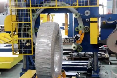 Wrapping machine for steel coils.