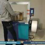 Small automatic strapping machine for boxes, model KH-102.