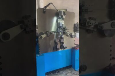 Machine for making steel strap belt buckles automatically.