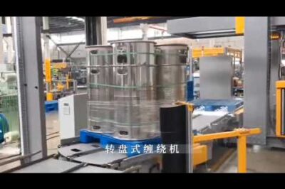 Automated pallet wrapping and horizontal strapping machine for packaging.