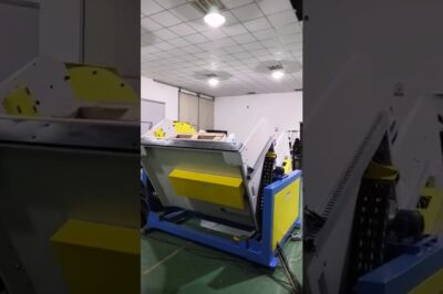 Automated assembly line with conveyor and upender.