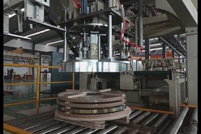 Automated coil handling and stacking system for steel strips.