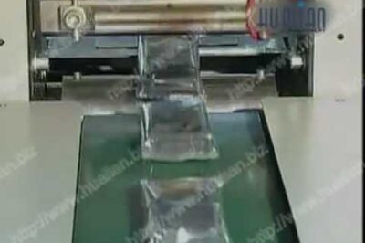Automatic horizontal pillow wrapping machine for packaging products.
