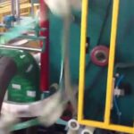 automatic machine for wrapping paper reels with orbital pallet stretch.