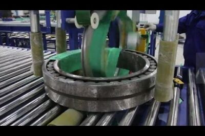Bearing packaging and wrapping machine automates the process efficiently.