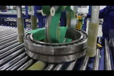 Bearing packaging and wrapping machine automates the process efficiently.