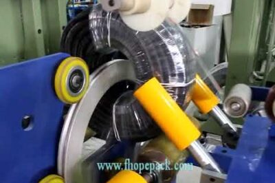 Coil film wrapper for corrugated hose.