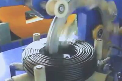 Coil film wrapper for semi-automatic electric cable wrap packaging.