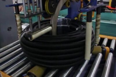Coil packaging line for pipes and hoses with automatic functionality.