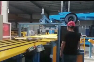 Coil packing and strapping machine for slitting line.