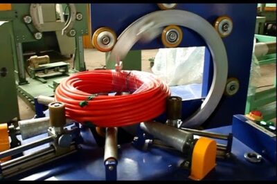 Coil packing and stretch wrapping machine for hoses and pipes.