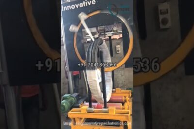 Coil stretch wrapping machine for heavy-duty steel coil packing.