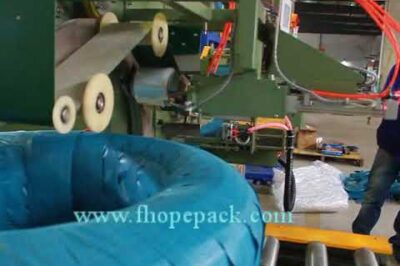 Coil stretch wrapping machine with end sealer – fully automated.