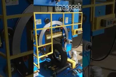 Coil wrapping machine efficiently packs tires for automated packaging solutions.