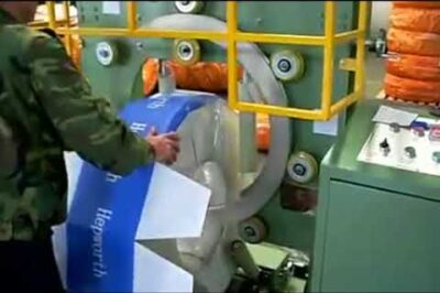 Coil wrapping machine for HDPE pipe packaging in less than 12 words.