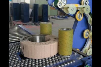 Compact bearing packing machine for efficient and automated packaging.